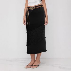 Black women's midi skirt with retro-inspired butterfly waist tie detail and moderate-stretch polyester fabric