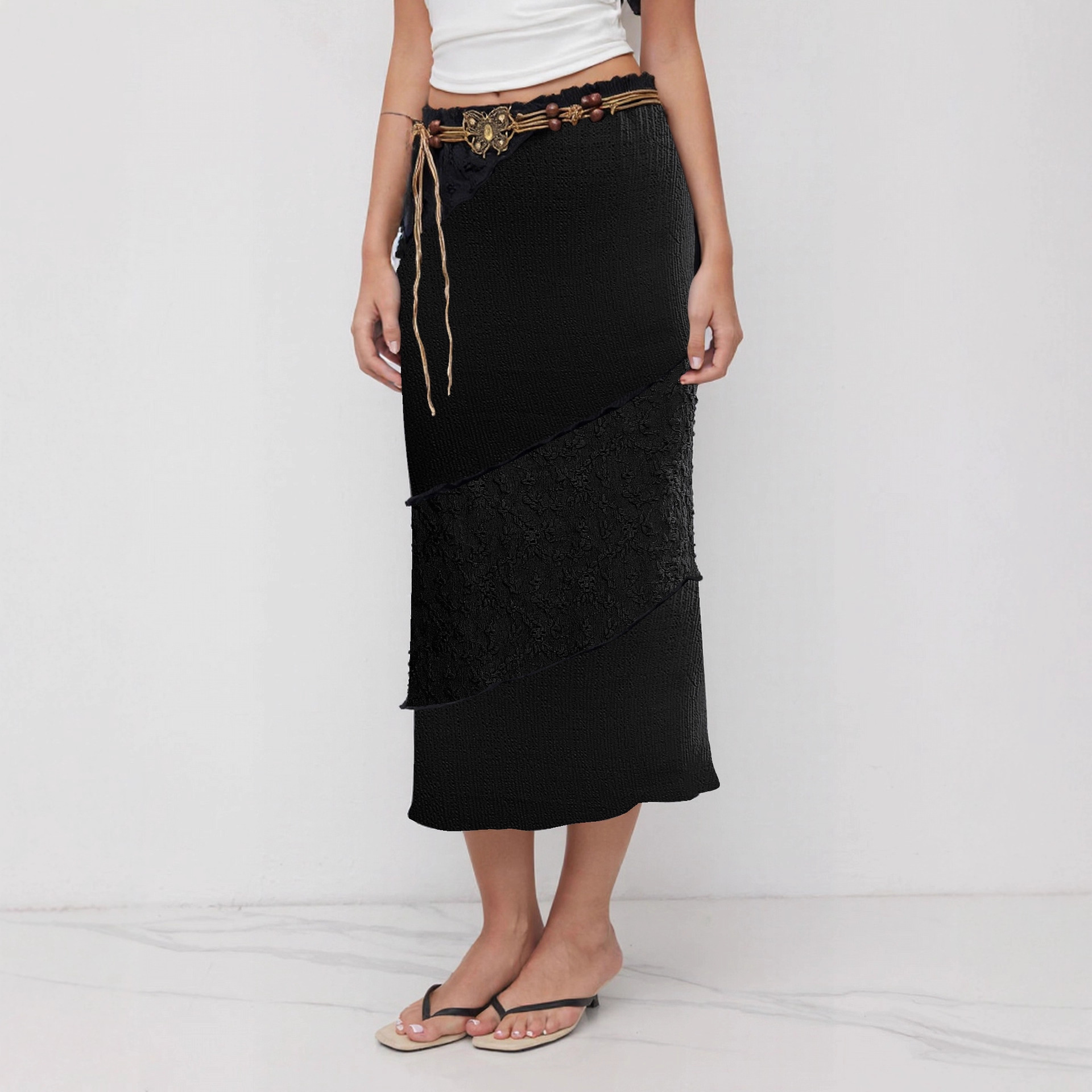 Black women's midi skirt with retro-inspired butterfly waist tie detail and moderate-stretch polyester fabric