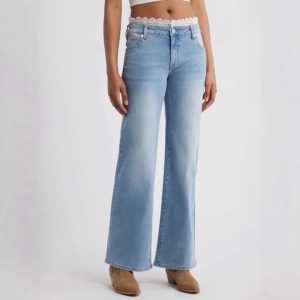 Women's light blue wide-leg flare jeans with lace trim, button details, mid-rise waist, and stretch denim