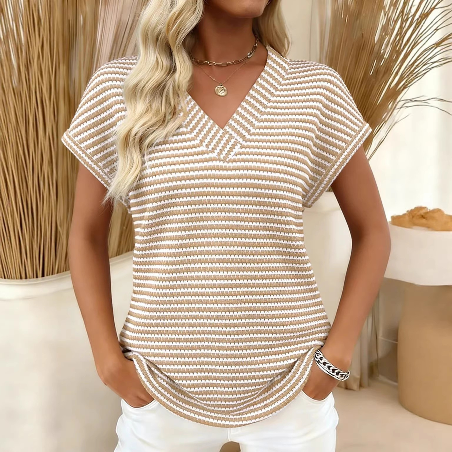 Women's V-neck color block knit pullover top with three-quarter drop-shoulder sleeves and button details